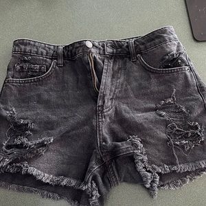 Distressed black jean shorts